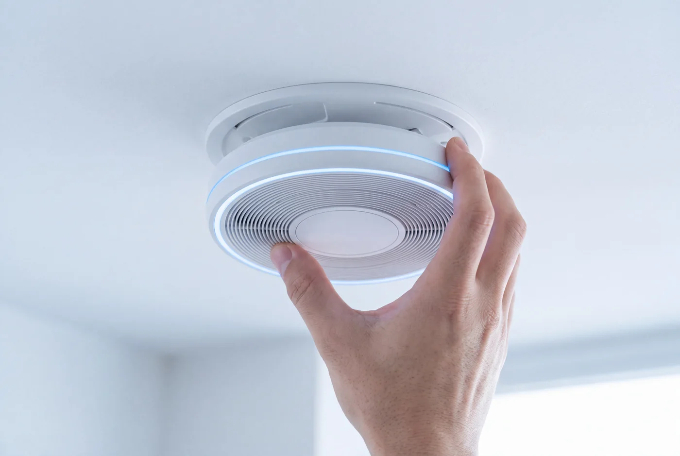 Twisting the Airceptor disc onto its ceiling plate